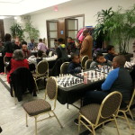 Youth get in a quick game of chess at the DIA before we go to the Adinkra workshop